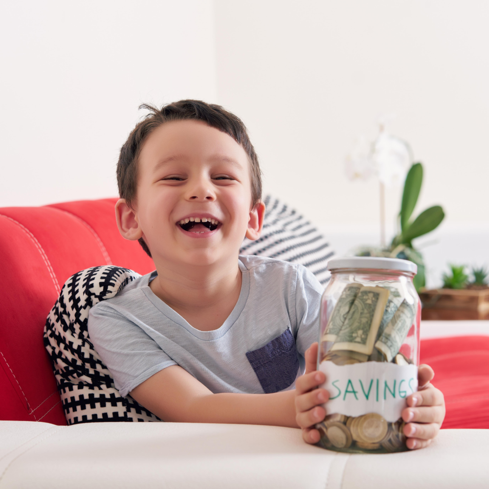 Kid holding a saving jar