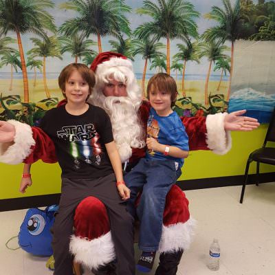Kids taking pictures with santa