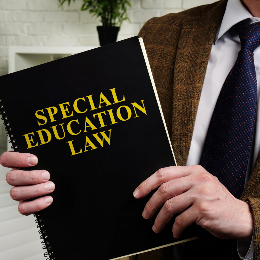 Man holding book with title Special Education Law